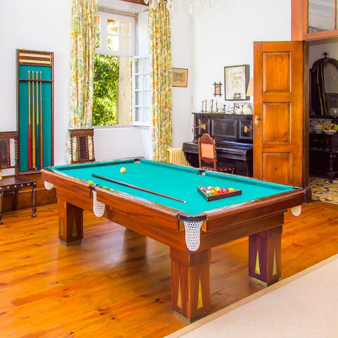 Challenge the others in the house to a pool tournament