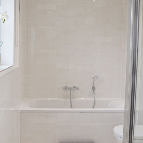 Luxuriate among bubbles in one of the home's two bathtubs