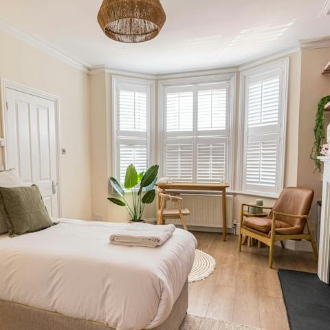 Wake up to plenty of sunshine with the main bedroom's bay windows