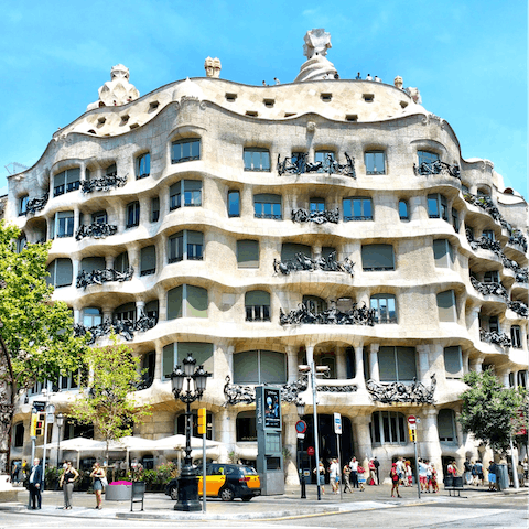 Visit Gaudí's other impressive buildings, like Casa Milà a fifteen-minute stroll away