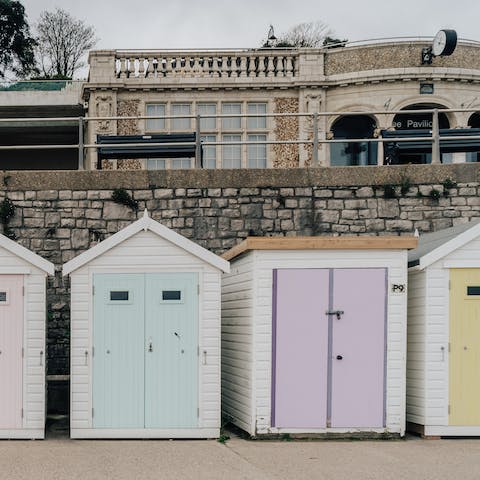Take a twelve-minute walk down to Lyme Regis Beach and rent a hut for the day