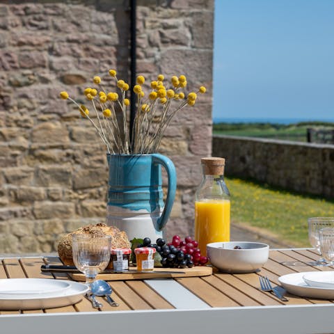 Tuck into an alfresco breakfast at the patio table before a countryside walk