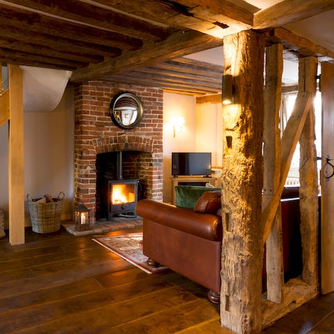 Cosy up in front of. the log burning stove on a chilly evening