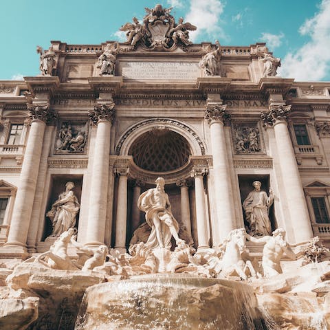 Make your way across the river and admire the iconic Trevi Fountain 