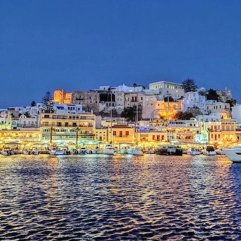 Take the short drive over to the picturesque town of Naxos for an evening out