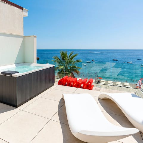 Enjoy relaxing on your balcony while gazing out at views of the sea