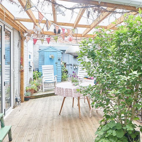 Enjoy your morning coffee on the charming covered patio 