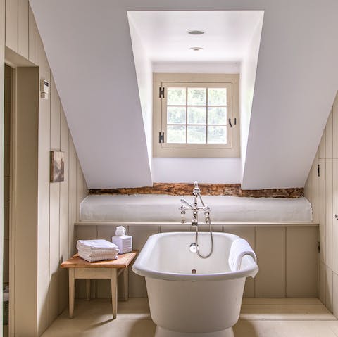 Run yourself a bath and soak in the luxurious freestanding tub