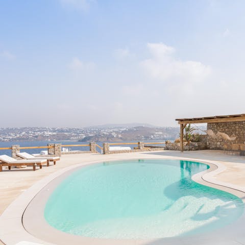 Take in sparkling Aegean Sea views from the swimming pool