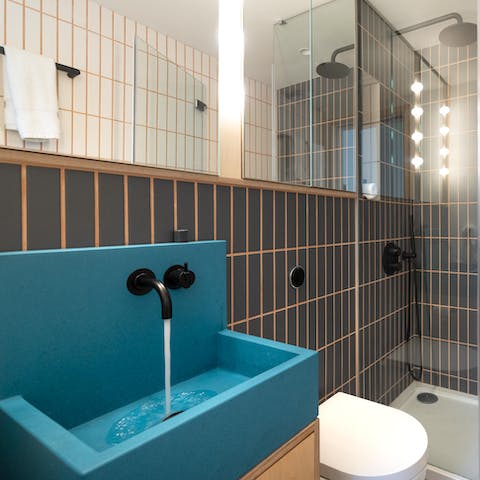 Marvel in a design-led interior with neon sinks and warm wood touches