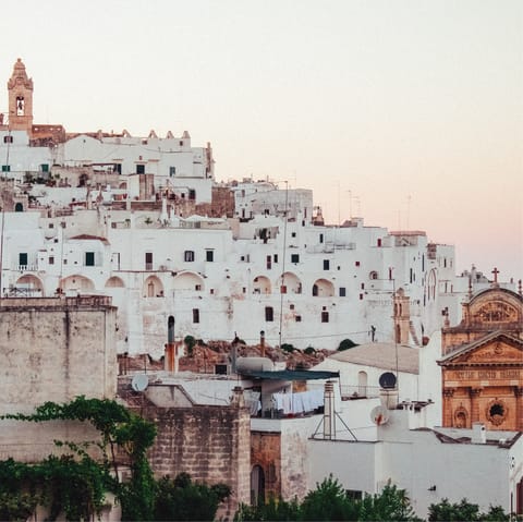 Visit the whitewashed old town of Ostuni sixteen-minute drive away