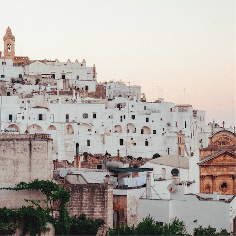 Visit the whitewashed old town of Ostuni sixteen-minute drive away