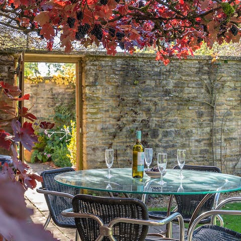 Take a chilled bottle of pinot grigio out to the beautiful walled garden