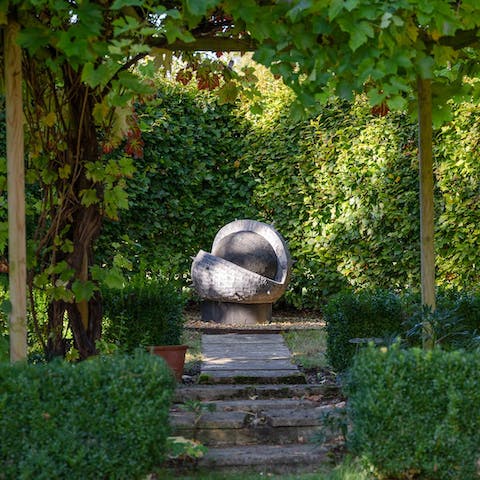 Listen to the tranquil sounds of one of the two water features in your half-acre garden