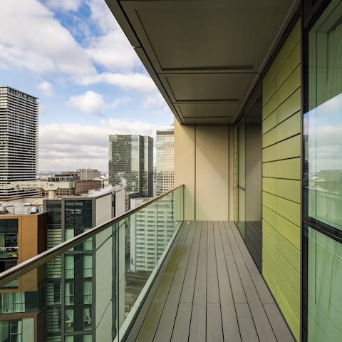 Take in views of the city skyline from the balcony
