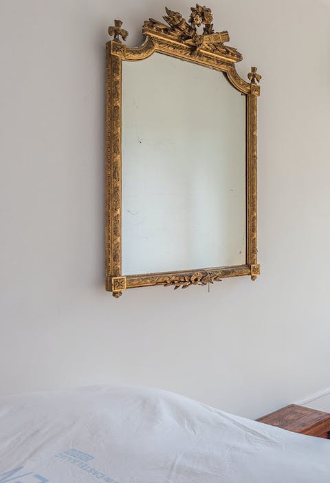 The smart antique gilded mirror