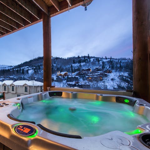 Admire the mountain views from the outdoor hot tub