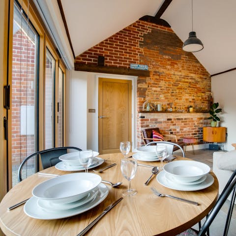 Dine in style with your friends in this unique living space with exposed brickwork
