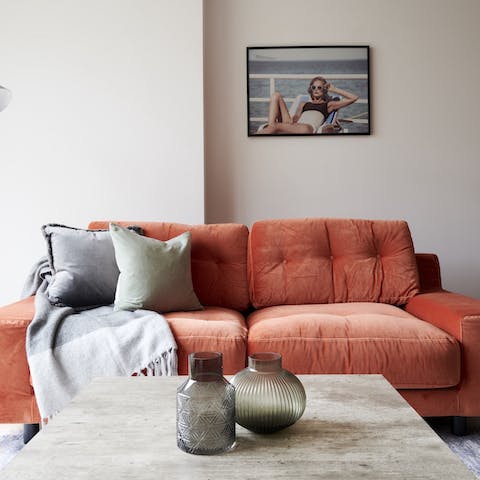 Fall back into the squashy sherbet orange sofa and rest for a while