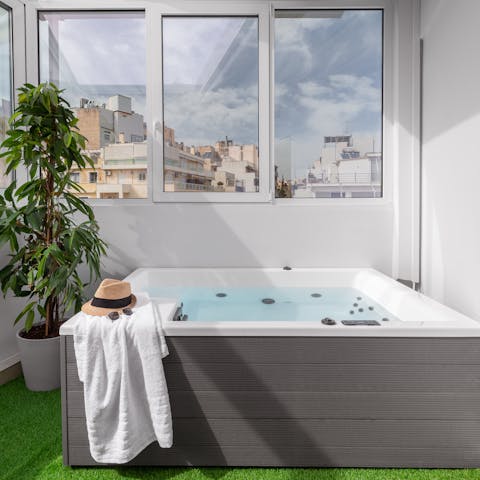 Enjoy the rooftop view from the hot tub on the enclosed terrace
