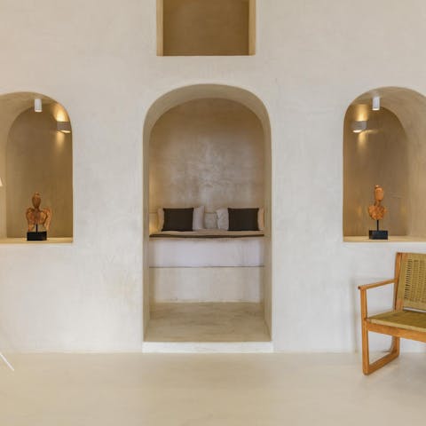 Sink into a peaceful slumber in the unique, cave-like bedroom