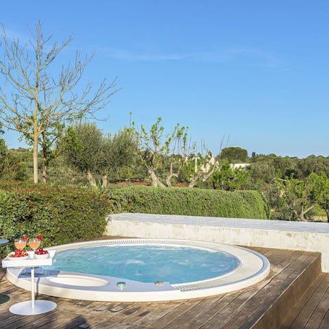 Sip a glass of Prosecco in the hot tub and admire the surrounding natural beauty