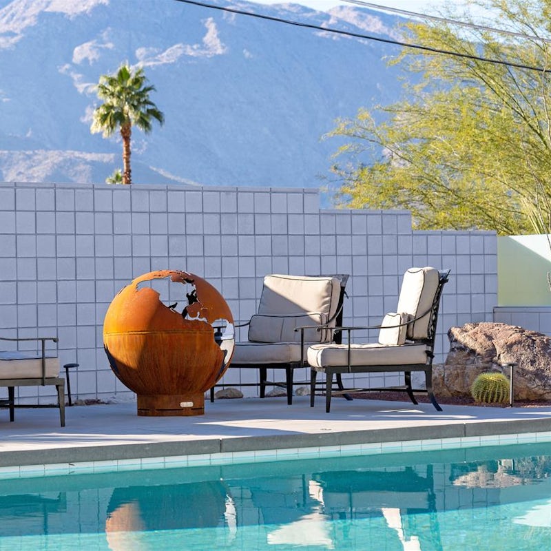Sip wine around the fire pit, watching as the sun disappears behind the mountains