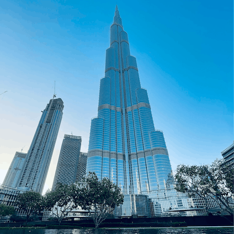 Admire the Burj Khalifa at night and watch the show at the Dubai Fountain, one stop on the MRed Metro line 