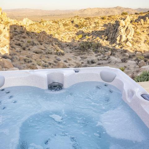 Soak in the bubbling hot tub overlooking the endless desert landscape