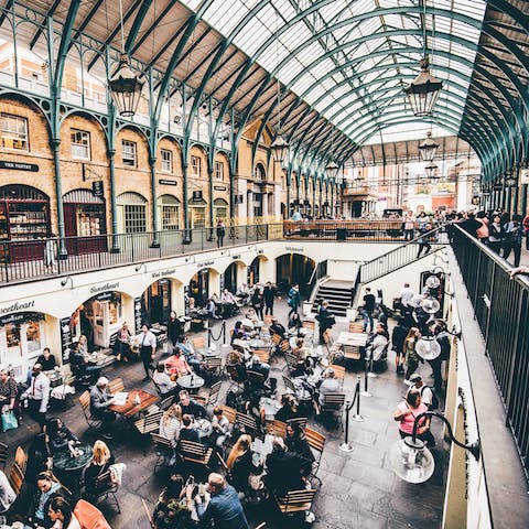 Explore the shops and restaurants in Covent Garden Market, a one-minute walk away
