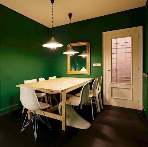 Savour a slow dinner amid the moody hue of the dining room