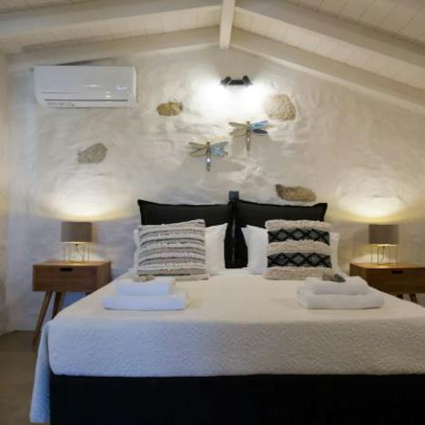 Enjoy a traditional place to sleep with wooden ceilings and thick white walls