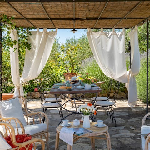 Gather together for a celebratory barbecue feast beneath the pergola