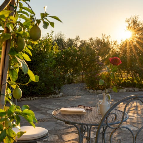 Sip a glass of wine at sunset while enjoying the fresh air perfumed with olive and citrus trees