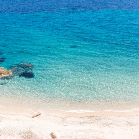 Venture out to the stunning Lourdas Beach, just 150m from the villa