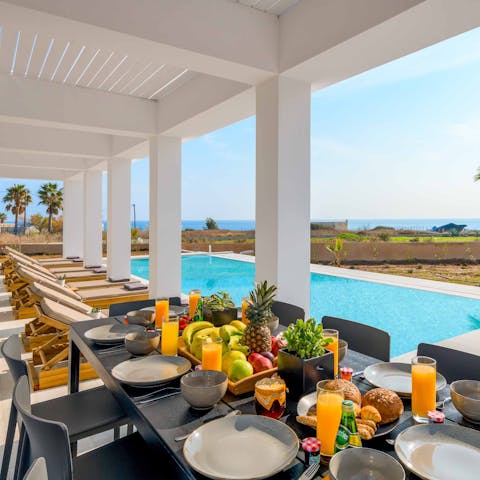 Drink or dine alfresco on the covered poolside terrace