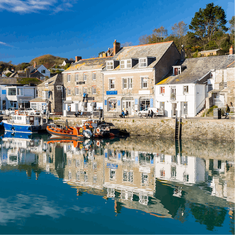 Explore Padstow's bustling harbour, less than a ten-minute walk away