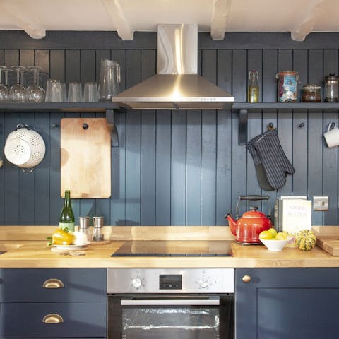 Cook up a delicious roast dinner in the charming blue kitchen