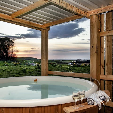 Enjoy a long, luxurious dip in the hot tub as you admire the views