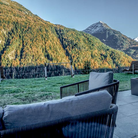 Relax to views of the sun setting behind the mountains