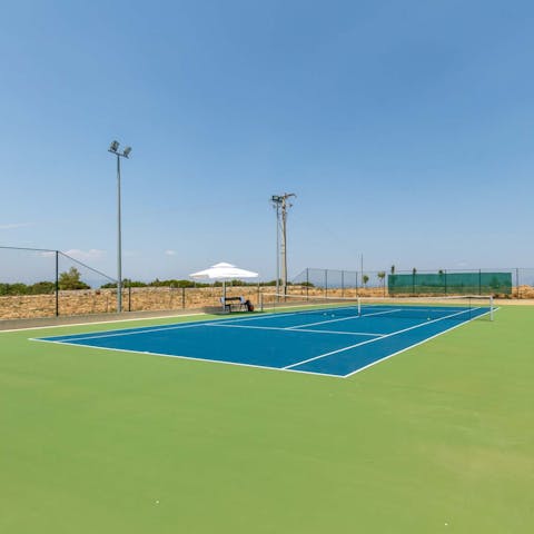 Challenge your loved ones to a game of doubles on the tennis court