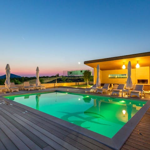 Enjoy a swim at sunset in your private pool