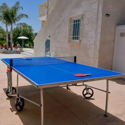 Challenge your loved ones to a game of table tennis in the sunshine