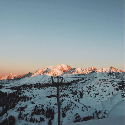 Take the cable cars to the top and glide down the slopes in Megève