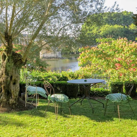 Relax in the romantic setting of the riverside garden 