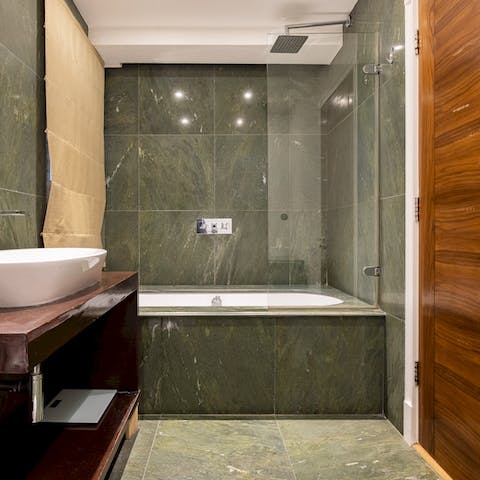 Lock the door and enjoy an uninterrupted soak in the green bathtub