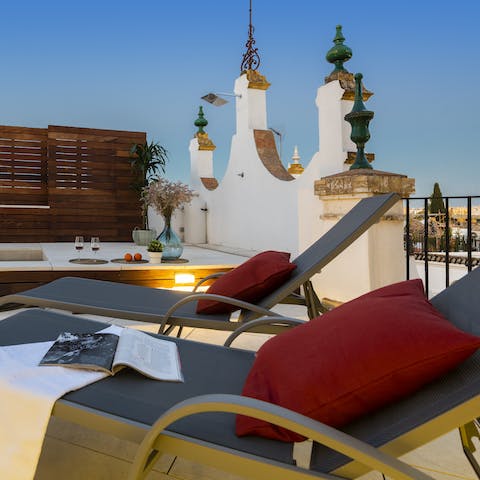 Relax at the rooftop's lounge area after fun-filled days out in Seville