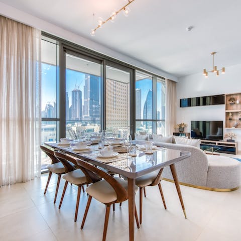 Gather around the dining table for home-cooked meals and spectacular views of the city