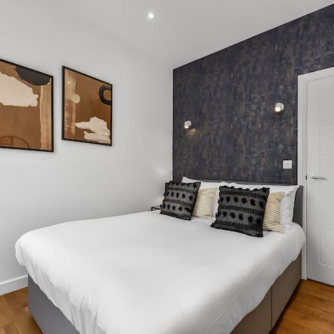 Wake up in the stylish bedroom feeling rested and ready for another day of sightseeing
