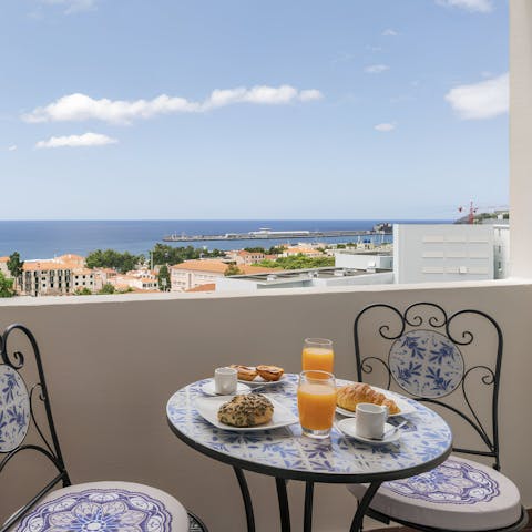 Enjoy breakfast with a view from the private balcony